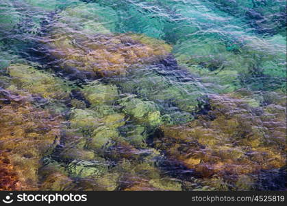 Clear sea water with pebbles