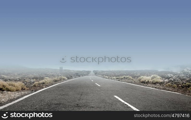 Clear sky above an empty rural road
