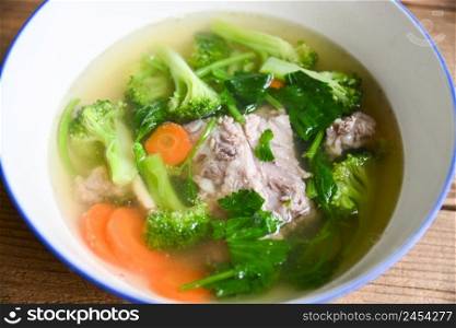 Clear Soup bowl with pork ribs  vegetable carrot broccoli soup and celery, Food healthy menu