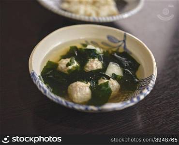 Clear soup with seaweed and minced pork . THAI food