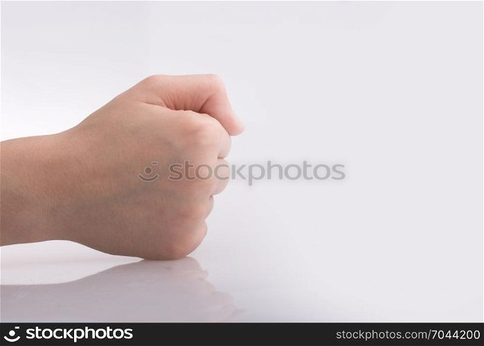 Clenched fist hand on a white background