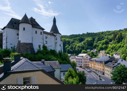 Clervaux, Luxembourg - 4 June, 2022: view of the picturesque and historic city center of Clervaux with castle and church in northern Luxembourg