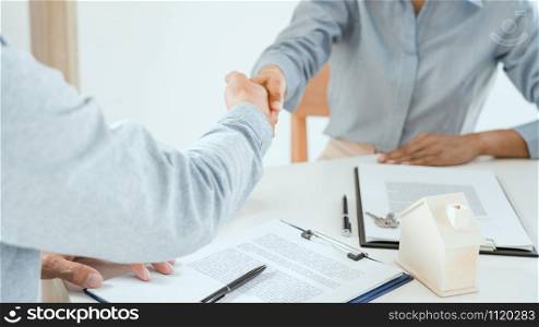 client customer handshake together for successful deal to buy insurance services make sale purchase deal agreement