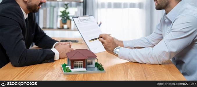 Client review loan contract with real estate agent, discussing term, interest and property ownership. Analyzing legal document, reading agreement before deciding. Real estate transaction. Fervent. Client review loan contract with real estate agent and discussing term. Fervent