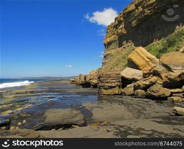 cliff and tidal platform at pacific. cliff and tidal platform at the pacific coast of australia