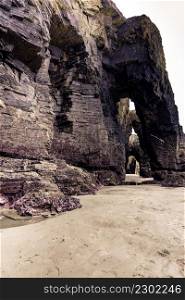 Cliff formations on Cathedral Beach in Galicia Spain. Playa de las Catedrales, As Catedrais in Ribadeo, province of Lugo. Cantabric coastline in northern Spain. Tourist attraction.. Cathedral Beach in Galicia Spain. Tourist attraction.