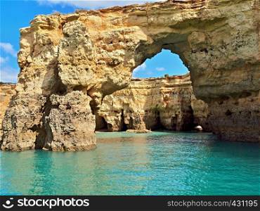 Cliff gate in the Atlantic ocean at the algarve coast of Portugal
