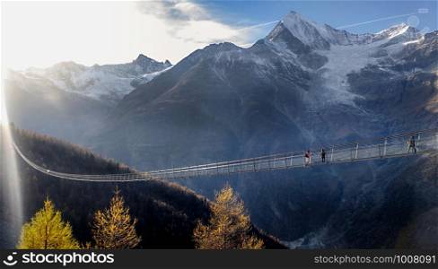 Cliff walk. Grindelwald First Switzerland. Long suspended bridge crossing abysm in Switzerland