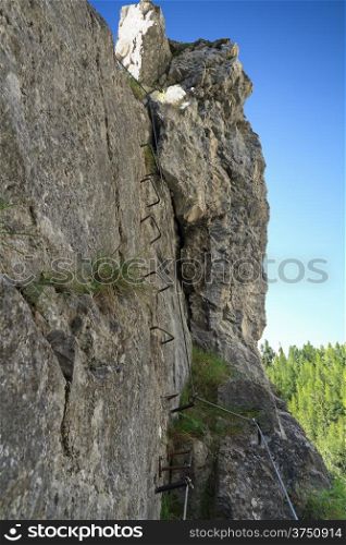 cliff with stirrups in Sass de Rocia, Italian Dolomites