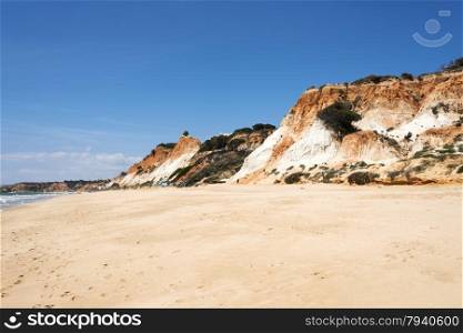 Cliffs at Praia da Falesia near villamoura in portugal area algarve with big staiors to the beach