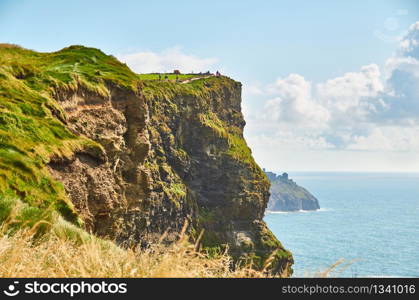 Cliffs of moher in county Clare, Ireland. One of the most popular tourist destinations. Sunny summer day. Cliffs of moher in county Clare, Ireland