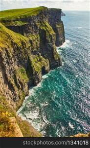 Cliffs of moher in county Clare, Ireland. One of the most popular tourist destinations. Sunny summer day. Cliffs of moher in county Clare, Ireland