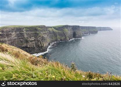 Cliffs of Moher in Ireland in a cloudy day
