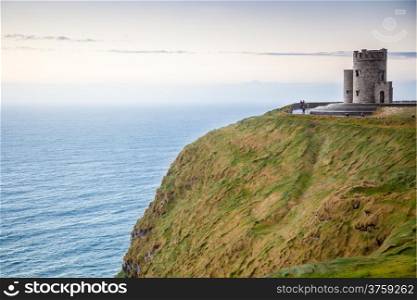 Cliffs of Moher - O Briens Tower castle at sunset in Co. Clare Ireland Europe.