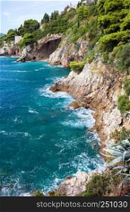 Cliffs on the Adriatic Sea scenic coastline near Dubrovnik in Southern Croatia, Dalmatia region.