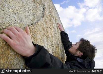 climber free climbing boulder