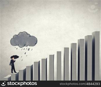 Climbing increasing graph. Businessman holding umbrella and waking on business graph