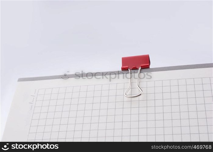 Clip on a checked notebook