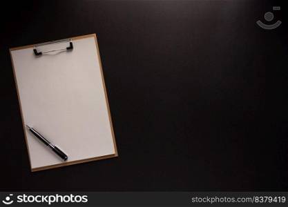 Clipboard and paper at black background texture. Creative idea concept