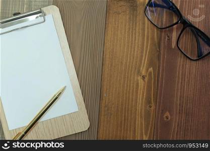 Clipboard blank white paper sheet, pen, glasses.memo template design concept.using for education, business, lifestyle with copy space.