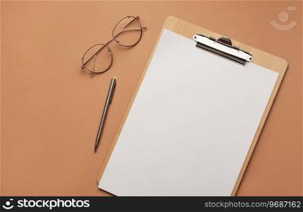 Clipboard with blank sheet  and glasses, workplace. 