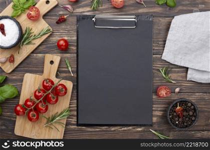 clipboard with ingredients beside