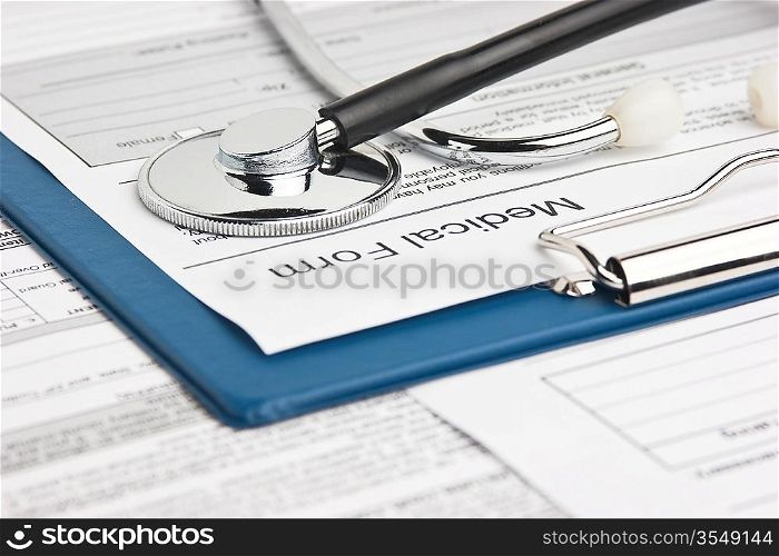 clipboard with medical form and stethoscope