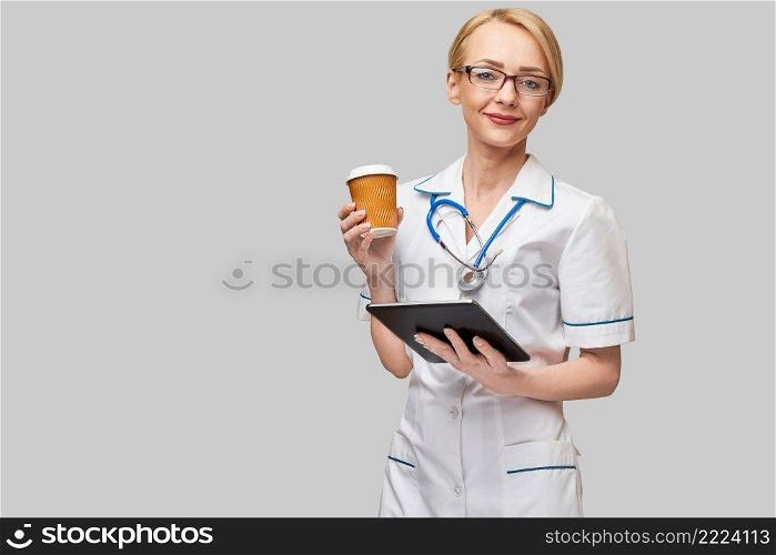 Clipboard with paper blank form with medical tools on blue background with cope space.. Clipboard with paper blank form with medical tools on blue background with cope space