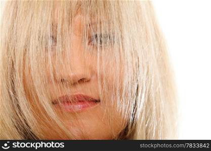 Cloce up blonde woman with hair covering face isolated over white background
