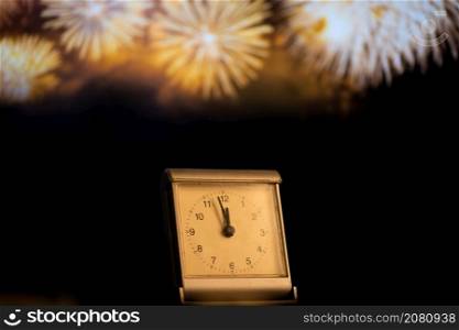 clock at midnight and fireworks New Year&rsquo;s eve celebration