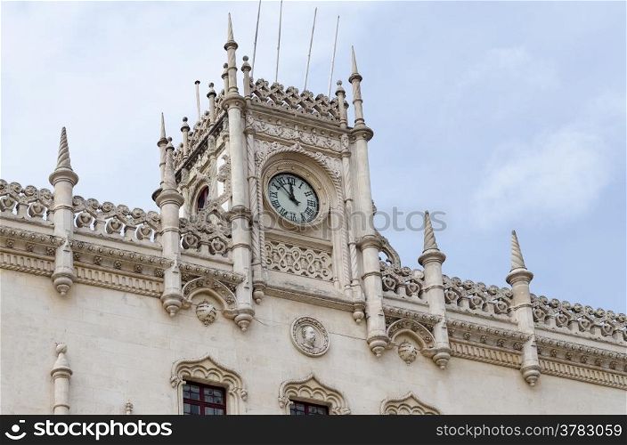 Clock detail on the facade of Rossio railway station in Lisbon in Portugal