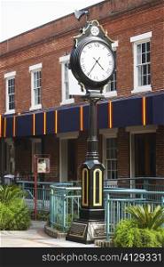 Clock in front of a building, Savannah, Georgia, USA