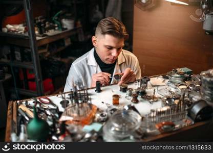 Clock maker repair broken clockwork mechanism. Mechanical watches precision repairing