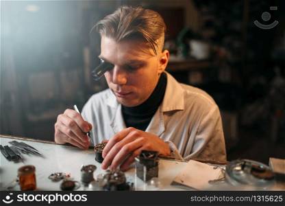 Clock maker repair old clockwork gear. Mechanical watches repairing
