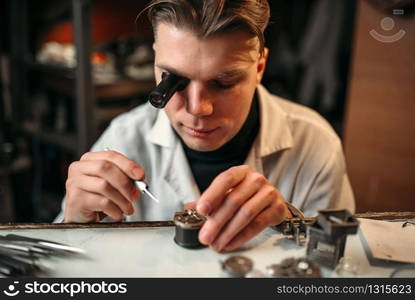 Clock maker repair old clockwork gear. Mechanical watches repairing. Clock maker repair old clockwork gear