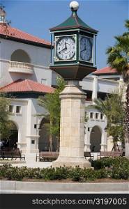 Clock on a column in front of a building, St. Augustine, Florida, USA