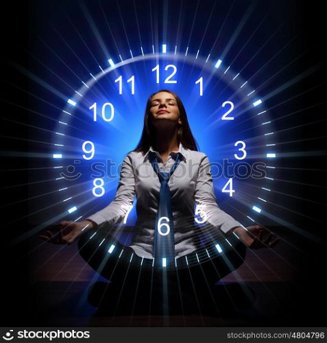 Clock. time concept. Young businesswoman sitting against blue background with clock interface