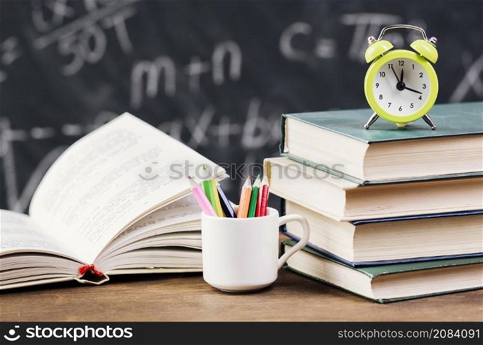 clock top textbooks teacher desk