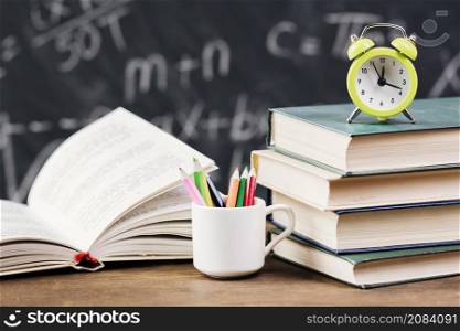 clock top textbooks teacher desk
