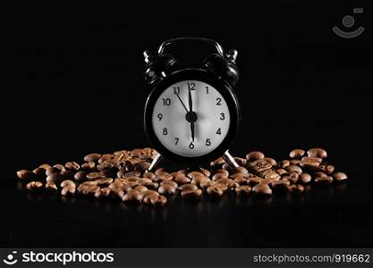 clock with coffee beans on a dark background. time to wake up. lack old style alarm clock isolated on black. time to wake up. lack old style alarm clock isolated on black. clock with coffee beans on a dark background
