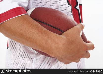 Close Crop of Man in Jersey Holding Football against a white background.