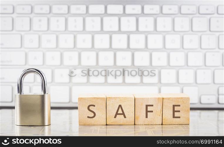 Close keypad lock with word SAFE on wooden cubes, white keyboard on background. Online safety, Information security, internet connection, system login, information privacy, database storage concepts.
