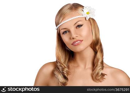 close portrait of an attractive young blond girl with an old fashion look with a daisy in the hair and a flowered dress smiling against white background