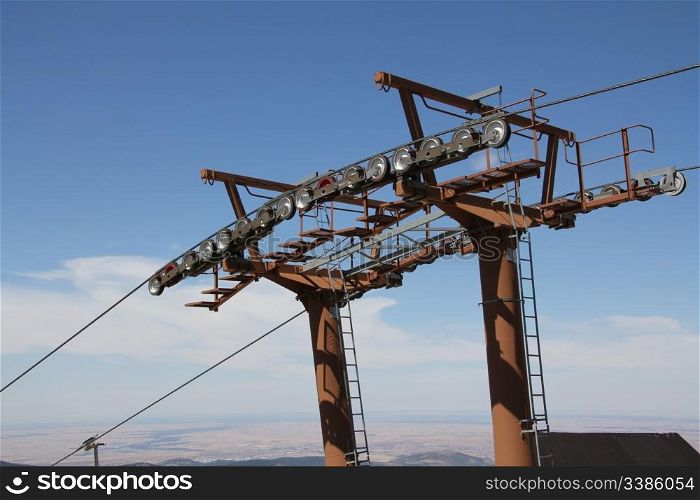 Close to the mast of a chairlift
