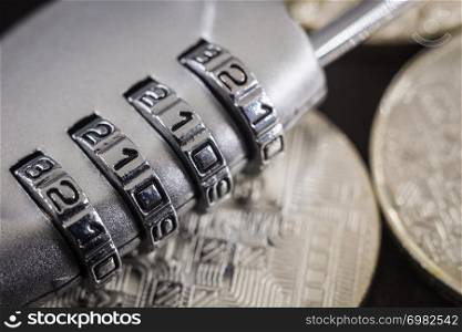 Close up 4 digits code number on silver combination pad lock on circuit board pattern of cryptocurrency. online banking, data protection, digital technology, cyber access, security encryption concept.