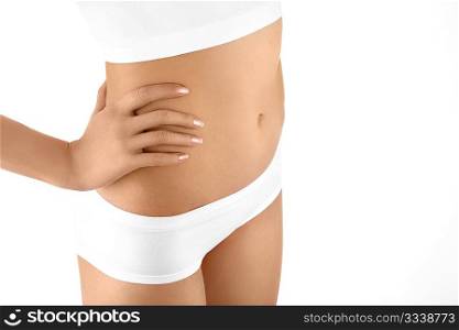 Close up a female stomach in shorts and a hand, isolated