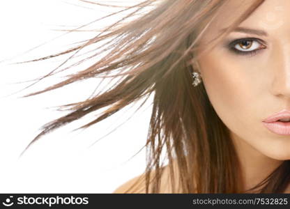 Close up - a half of face of beauty with flying hair, isolated