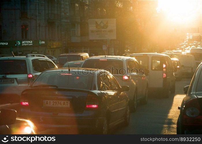 Close up afternoon traffic jam concept photo. Busy city. Evening rush hour. Front view photography with blurred background. High quality picture for wallpaper, travel blog, magazine, article. Close up afternoon traffic jam concept photo