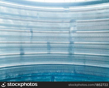 Close up aluminum fin of cooling condenser coil air condition system. abstract background.