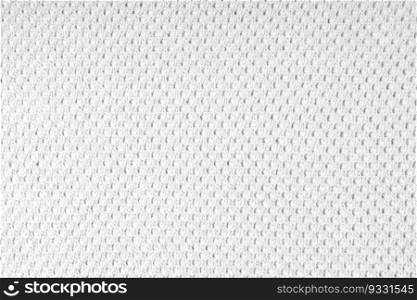 Close up background of knitted wool fabric with dots pattern. White color wool knitwear texture. Openwork abstract knitted jersey. Fabric abstract backdrop. Bright blue knitwear wool fabric texture background. Abstract textile backdrop